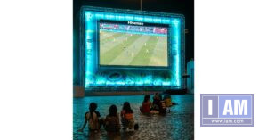 Kids watching soccer on bigscreen