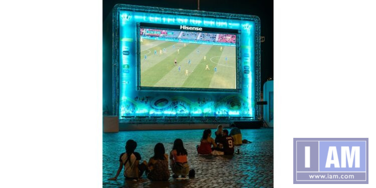 Kids watching soccer on bigscreen